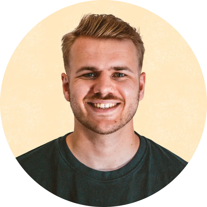 Cam James smiling, in a black t-shirt
